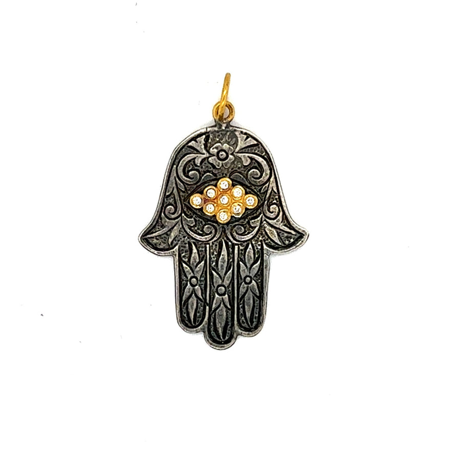 Black Hamsa hand pendant with gold accents on a white background