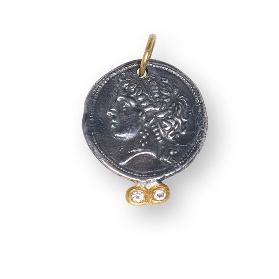 Decorative pendant with intricate design on a white background