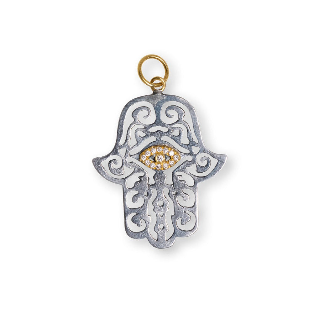 Silver Hamsa pendant with gold accents on a white background