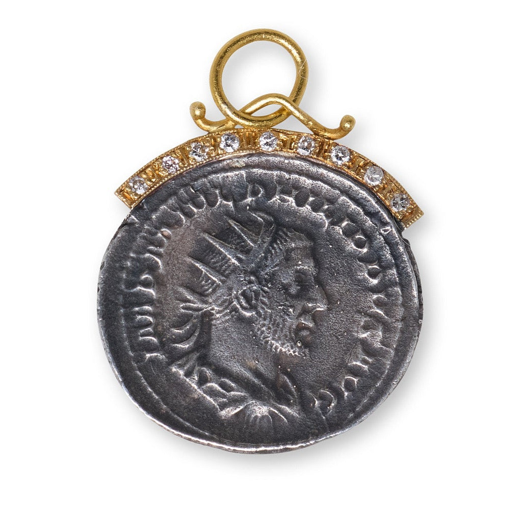 Medieval-style pendant with gold frame and gemstones on a white background