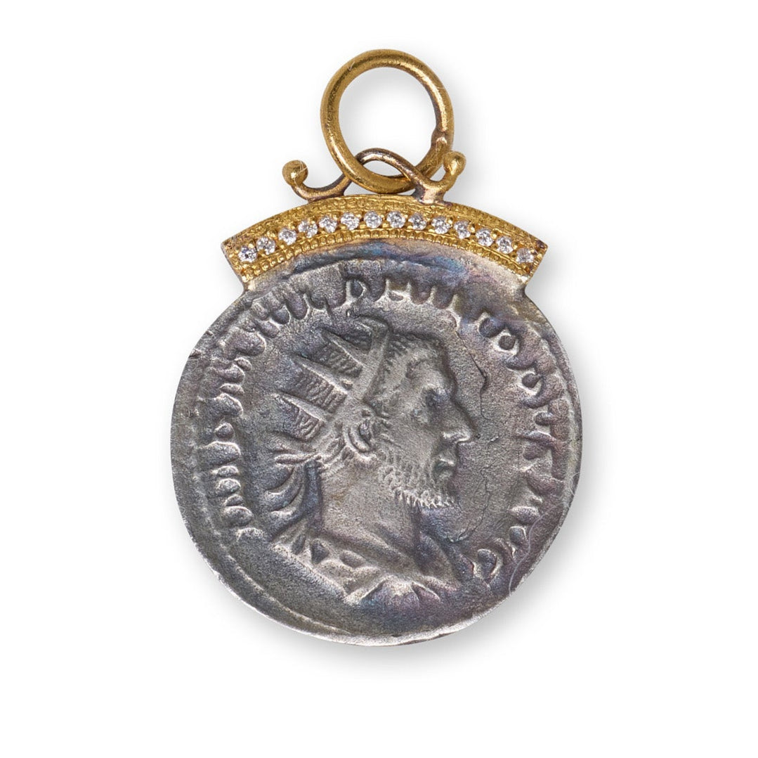 Medieval silver pendant with gold frame on a white background