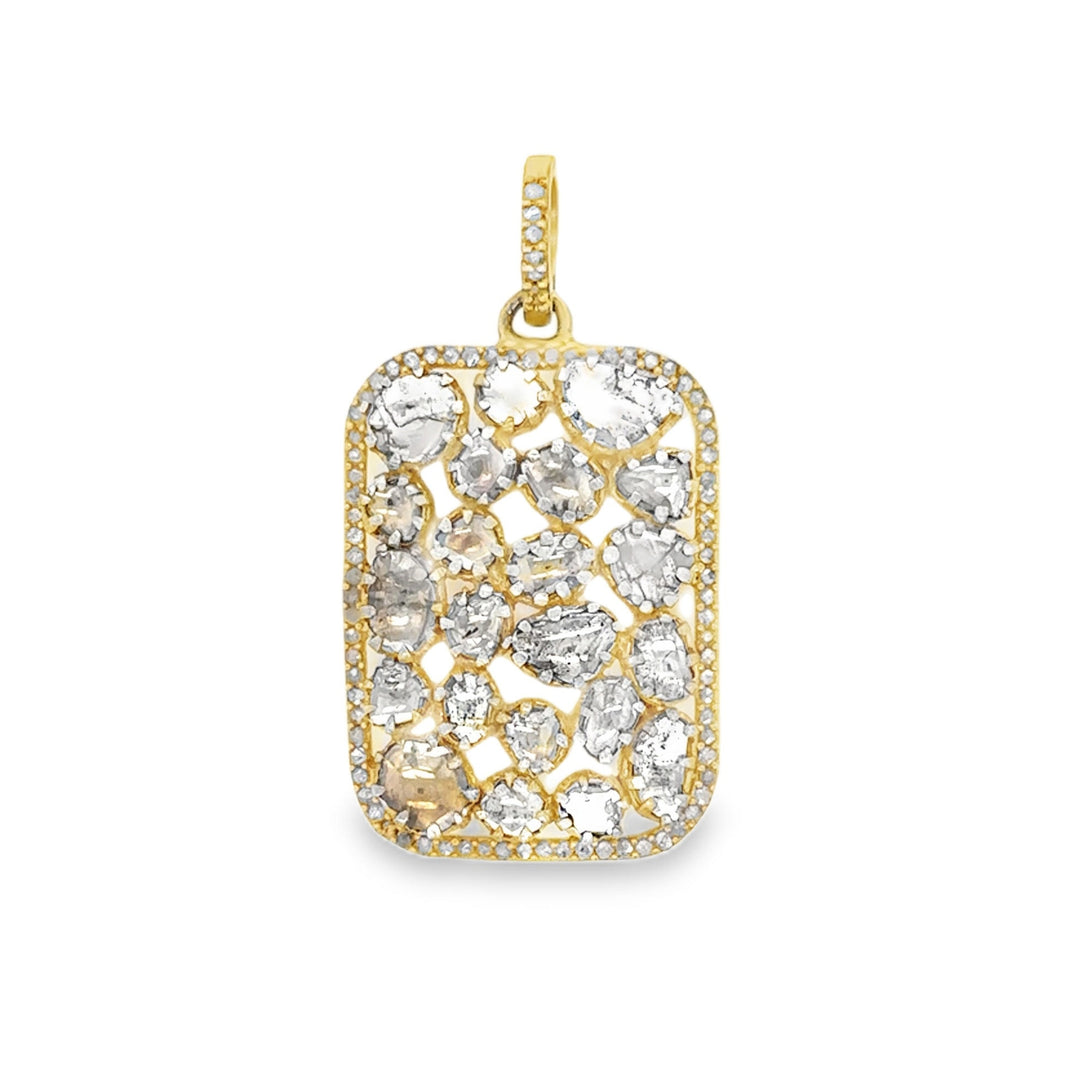 Gold and silver pendant on a white background