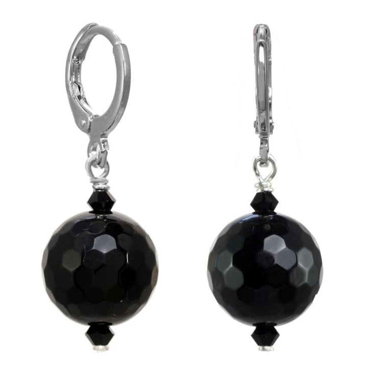 Pair of black beaded earrings on a white background
