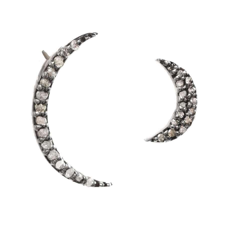 Crescent moon-shaped earrings with gemstones on a white background