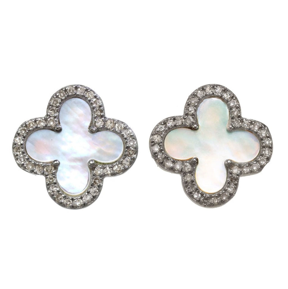 Pair of clover-shaped earrings with a white center and silver border on a white background