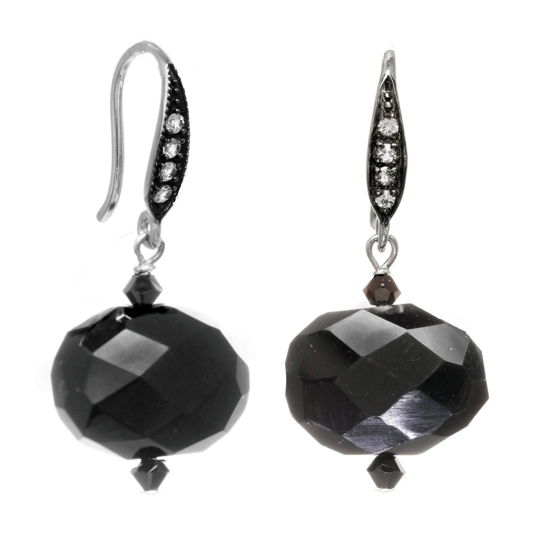Pair of black faceted bead earrings on a white background