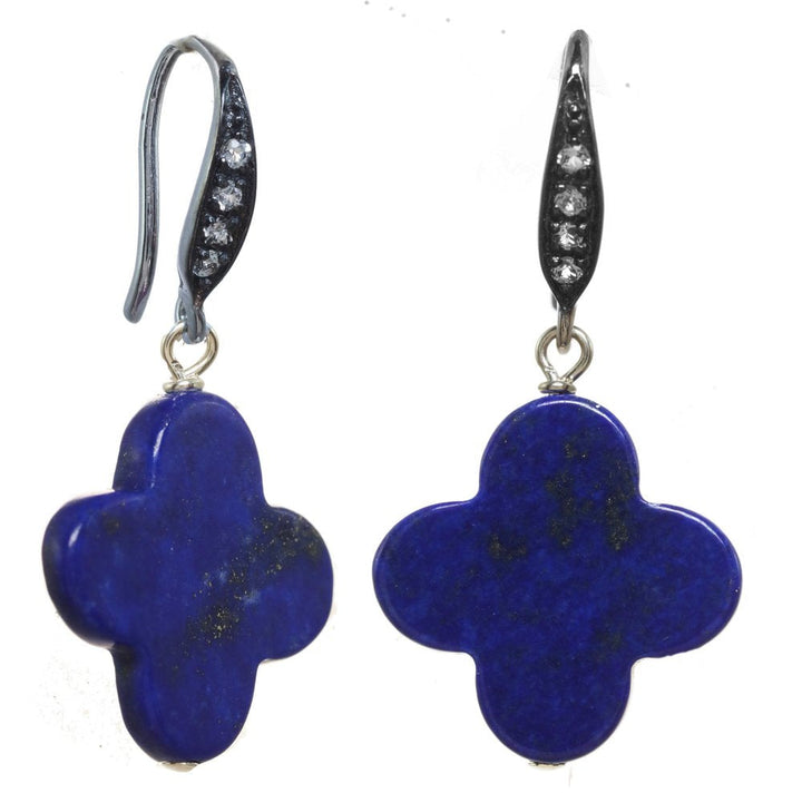 Pair of blue flower-shaped earrings with silver hooks on a white background