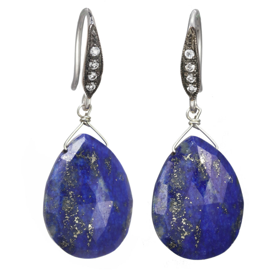 Pair of blue teardrop earrings with silver hooks on a white background