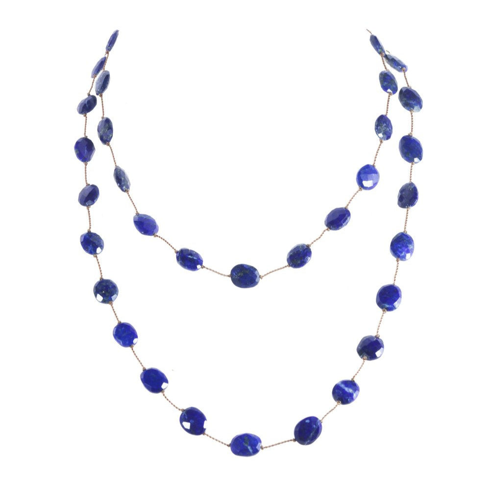 Necklace with blue beads on a white background