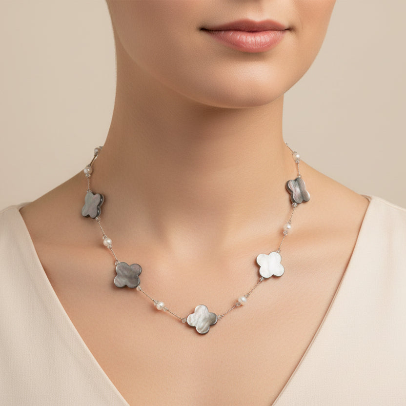 Necklace with clover-shaped pendants on a white background