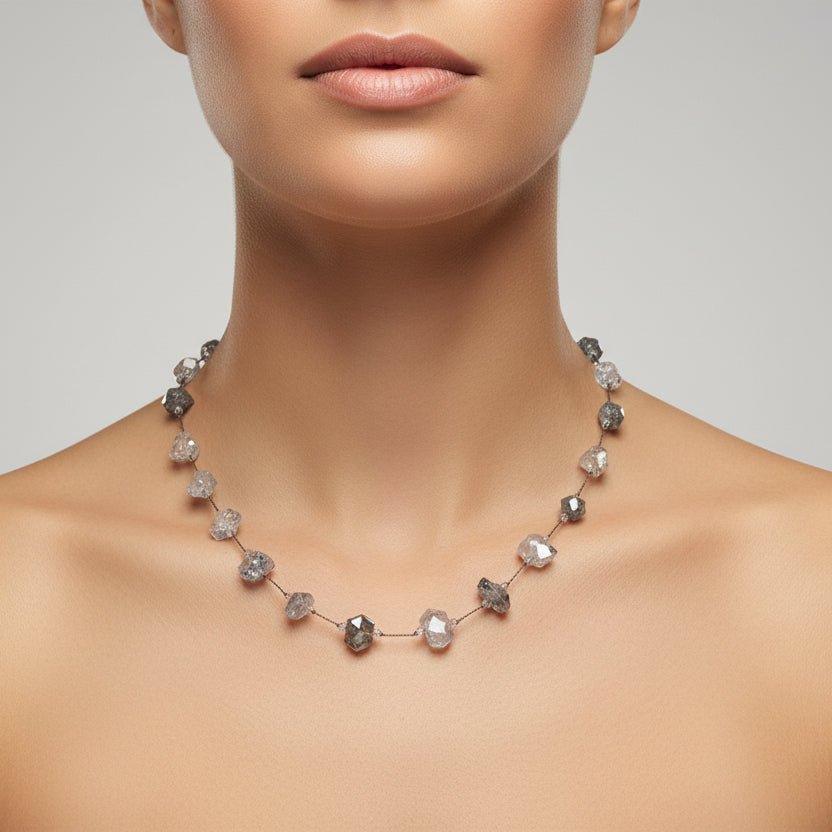 Necklace with blue and clear gemstones on a white background