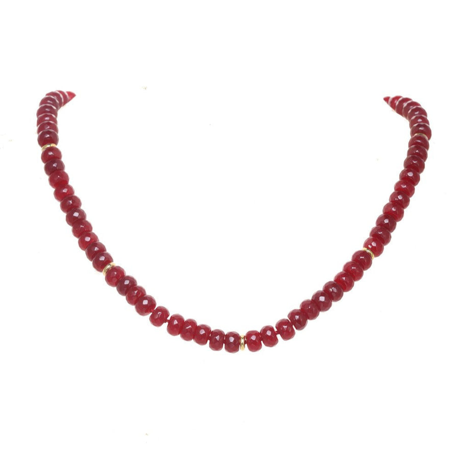 Necklace with red beads on a white background