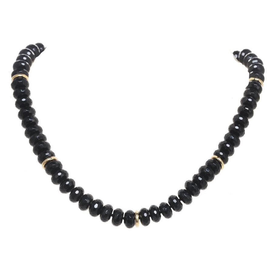 Black beaded necklace on a white background