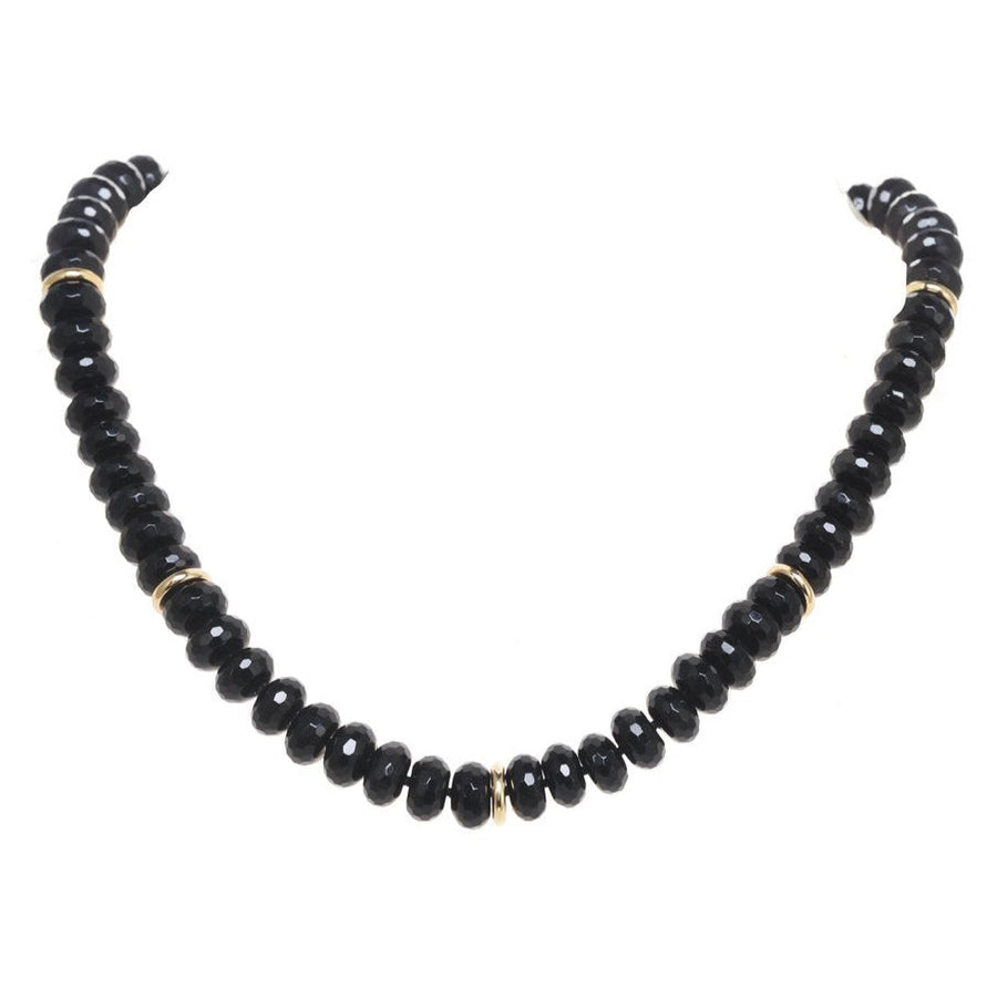 Black beaded necklace on a white background