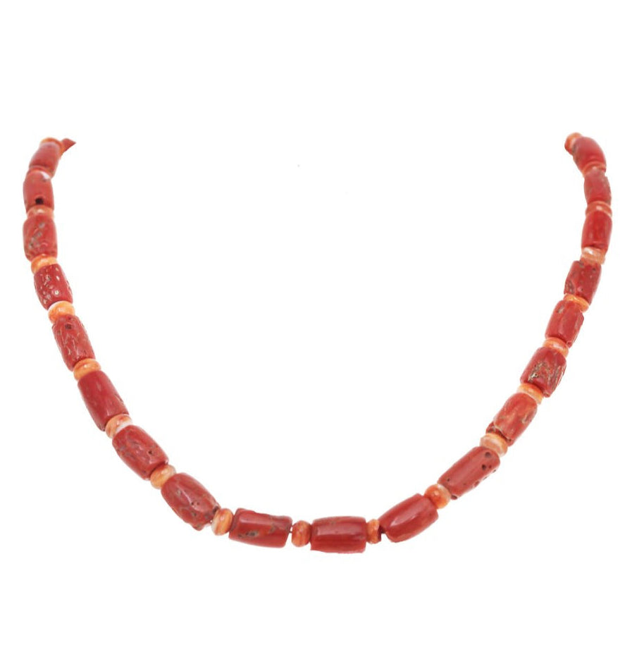 Necklace with red beads on a white background