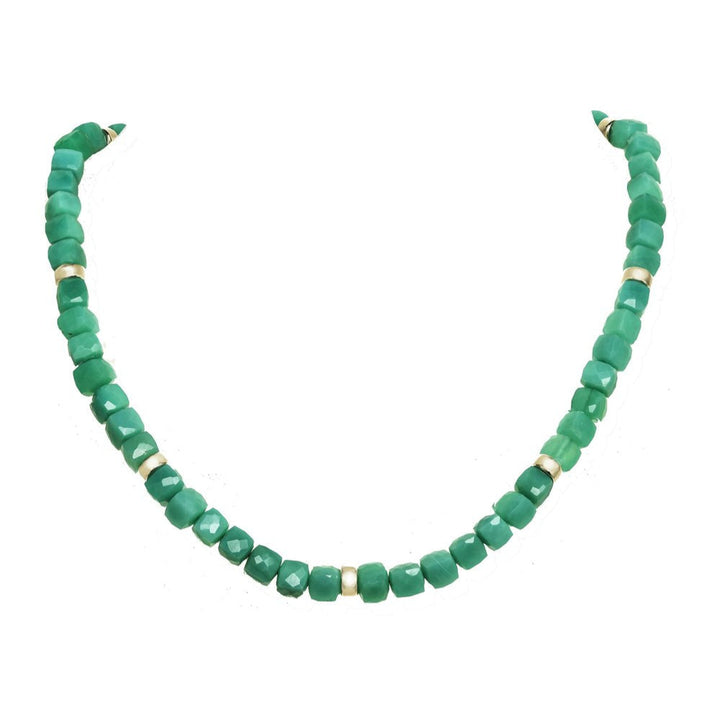 Green beaded necklace on a white background