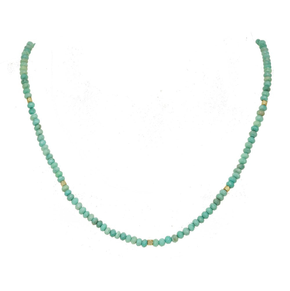 Turquoise beaded necklace on a white background