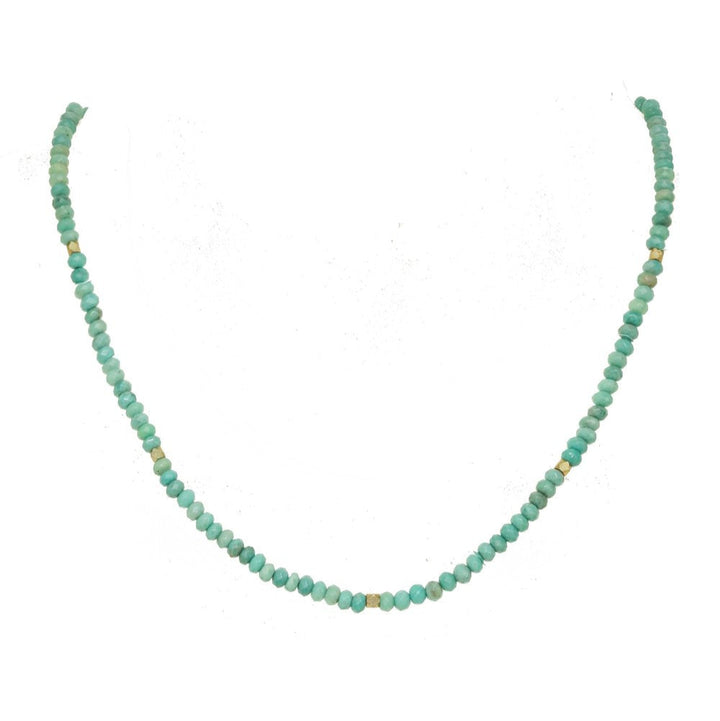 Turquoise beaded necklace on a white background