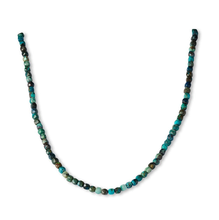 Beaded necklace with blue and green stones on a white background