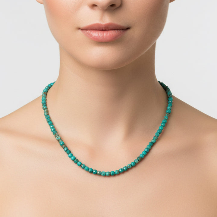 Necklace with turquoise beads on a white background
