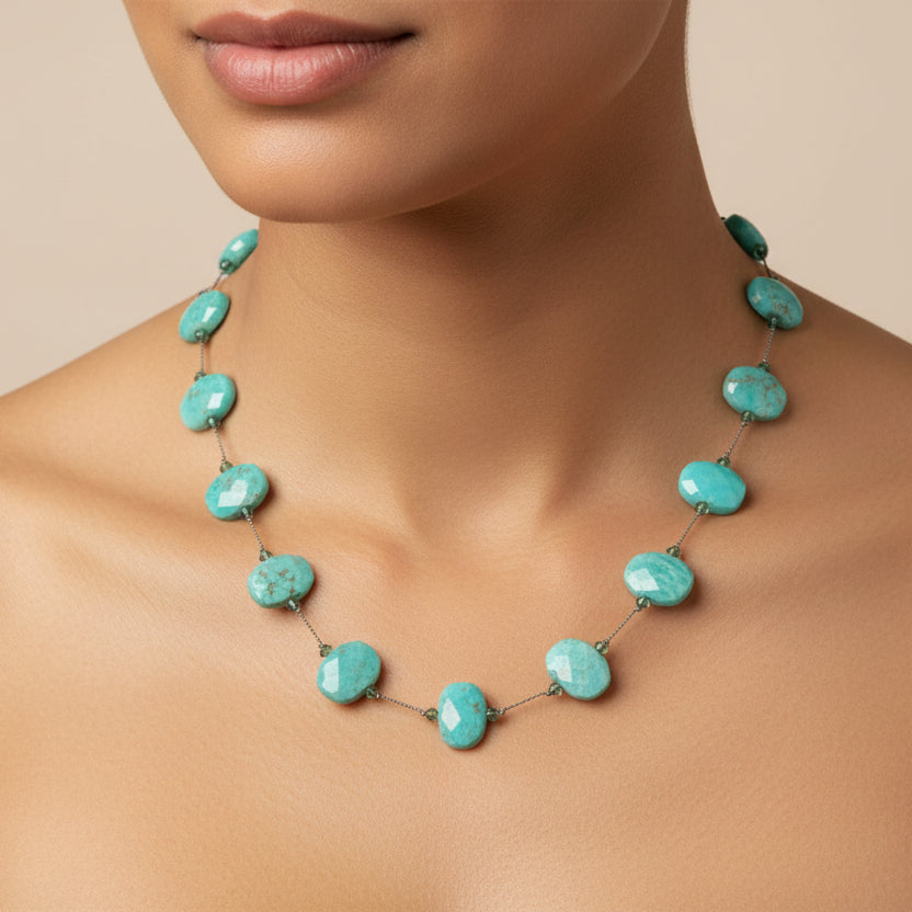 Turquoise beaded necklace on a white background