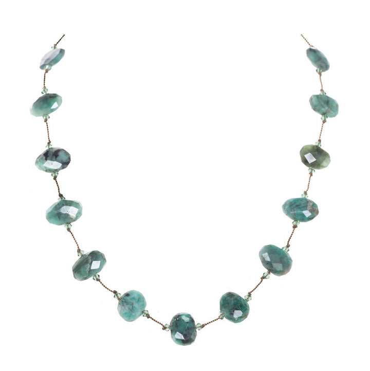 Necklace with green gemstones on a white background