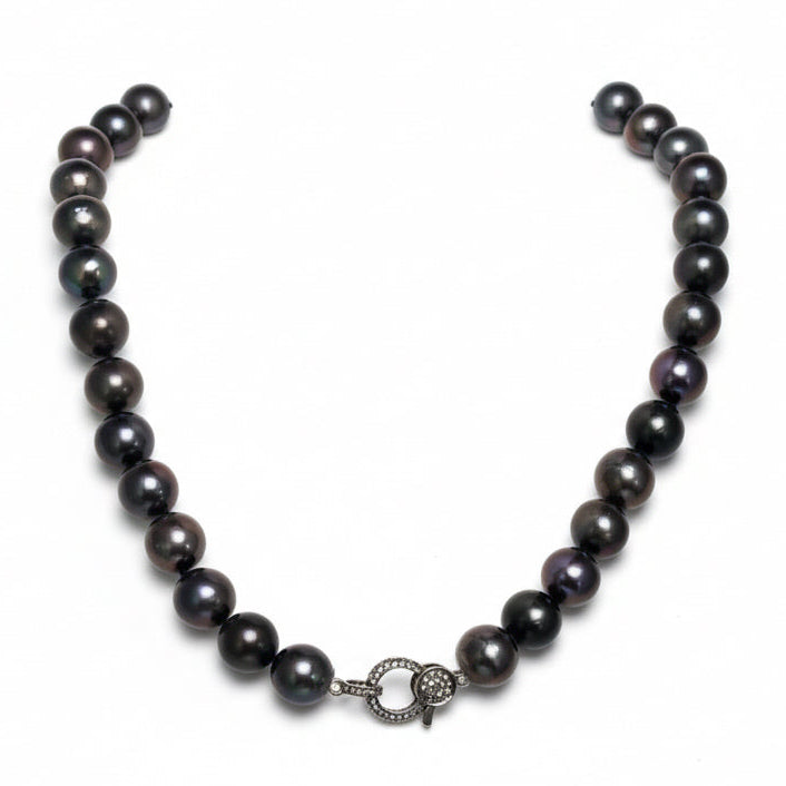 Black pearl necklace on a white background