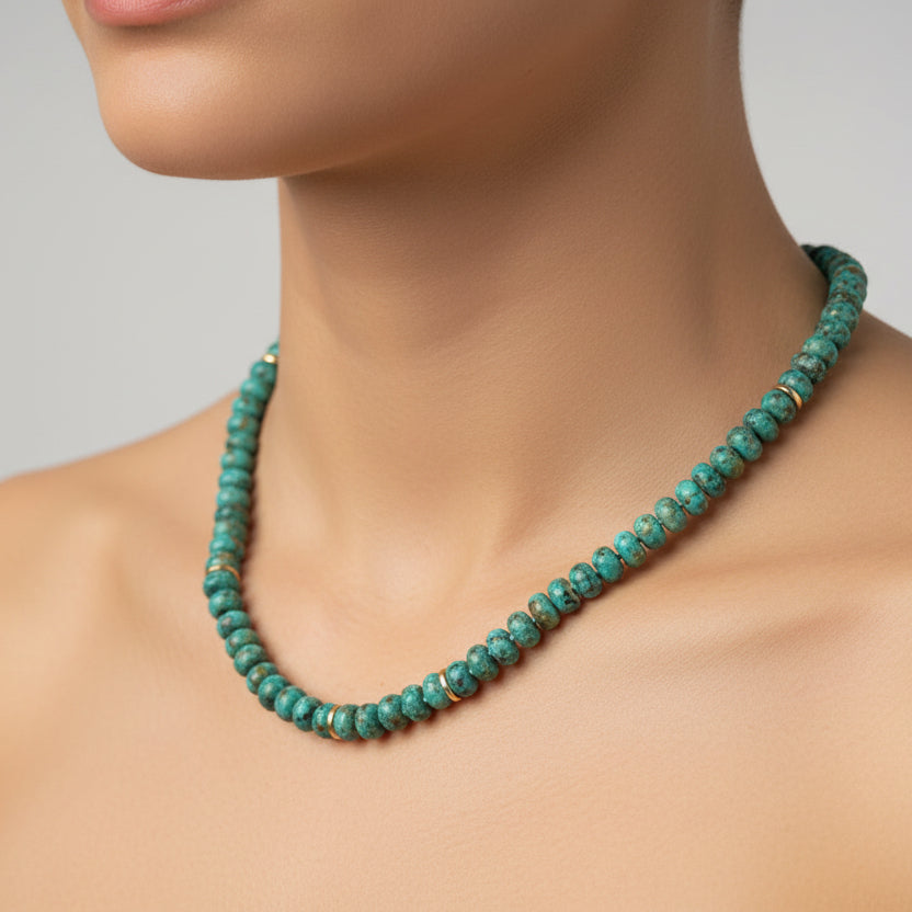 Turquoise beaded necklace on a white background