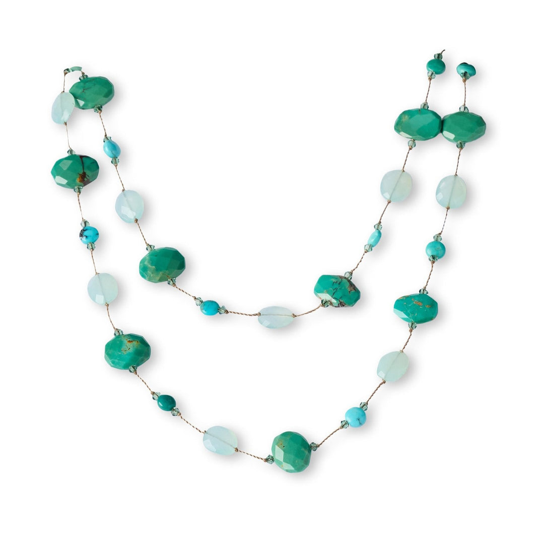 Necklace with green and blue beads on a white background
