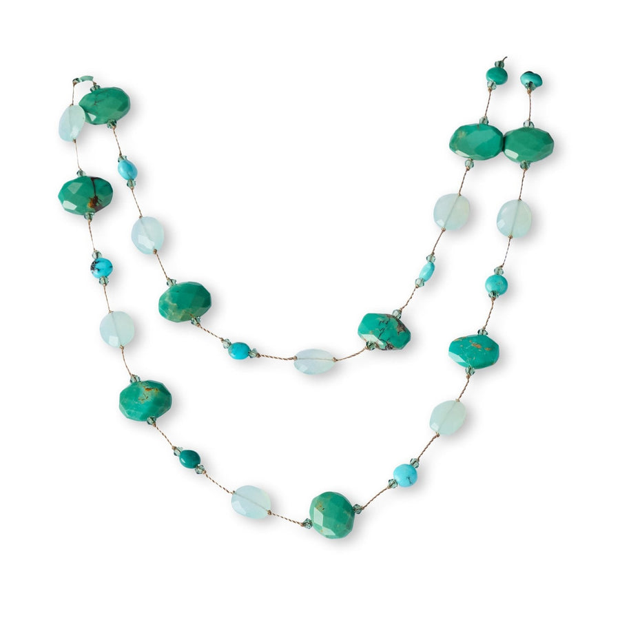 Necklace with green and blue beads on a white background