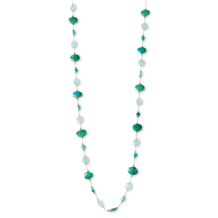 Long necklace with green and white beads on a white background
