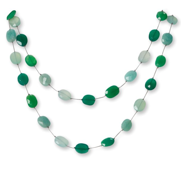 Green beaded necklace on a white background