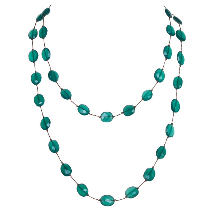 Turquoise beaded necklace on a white background