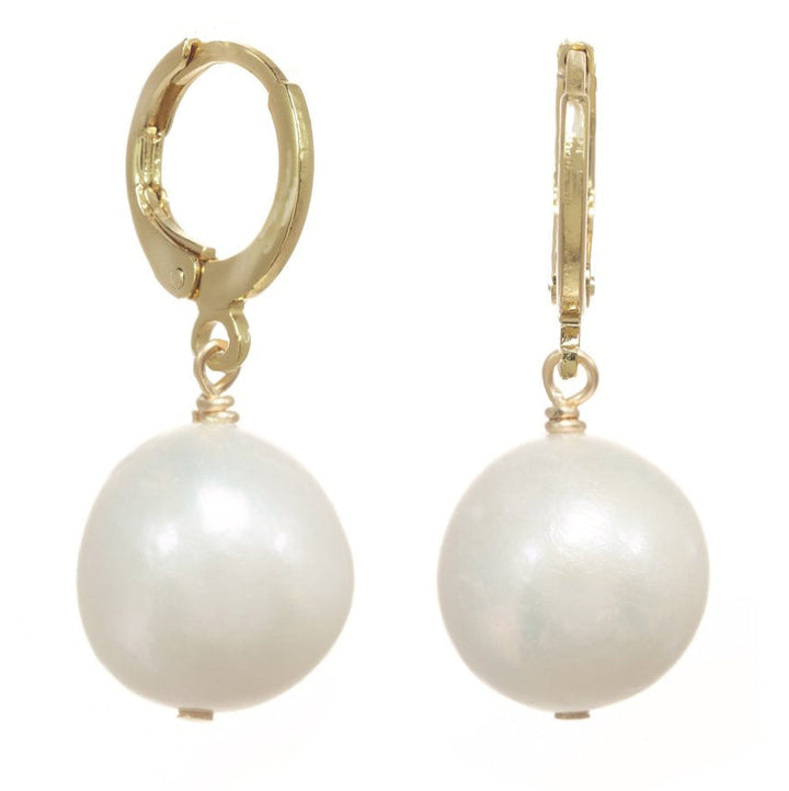 Pair of pearl earrings with gold hooks on a white background