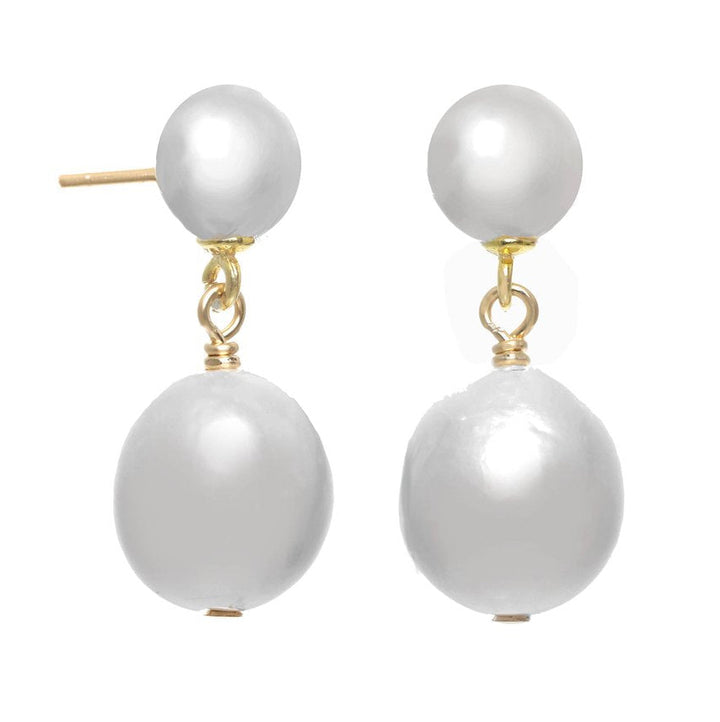 Pair of pearl earrings with gold hooks on a white background